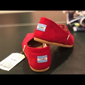 Women’s red Toms.  NWT